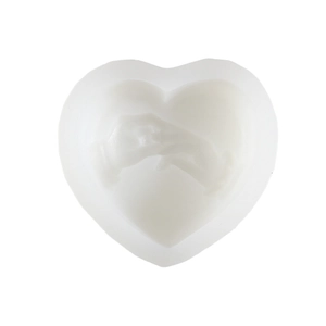 Detail of heart silicone mold featuring intricate hand-holding relief for candle making