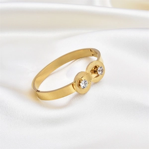 Elegant gold stainless steel bangle with double circle zircon inlays on white silk