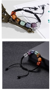 Close-up of rainbow seven chakra natural stone beads on a black woven cord bracelet