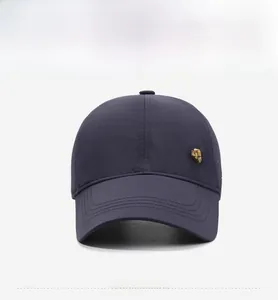 Detailed side view of navy blue baseball cap featuring a premium golden metal shield badge