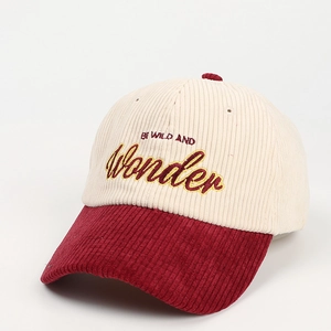 Detail of corduroy baseball cap with 'BE WILD AND Wonder' embroidery and contrast brim