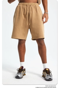 Detail of khaki heavy cotton sweat shorts with adjustable drawstring and elastic waistband
