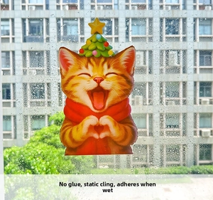 Detailed view of Christmas cat window static sticker with water-activated suction feature