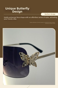 Detail of gold butterfly hinge with crystals on rimless purple gradient sunglasses