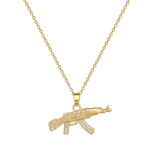 Luxurious gold-tone AK-47 rifle pendant necklace with sparkling crystal rhinestones