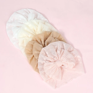 Newborn lace hats with mesh bows and floral embroidery in four pastel colors