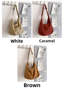 Three corduroy tote bags shown in white, caramel and brown against a neutral studio wall