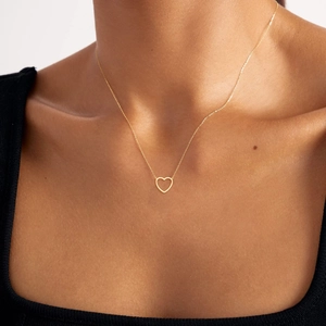 Minimalist 18k gold heart necklace for women featuring a hollow pendant on a fine chain