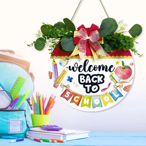 Round wooden Welcome Back to School door sign with eucalyptus leaves and colorful banner
