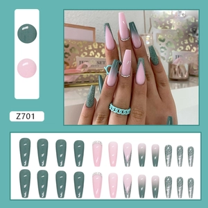 Fresh matcha green French press-on nails with glitter and diamonds in long ballet shape