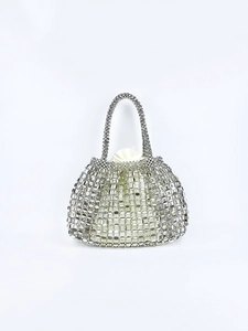 Detail of silver chainmail hollow-out tote with a white satin drawstring inner lining