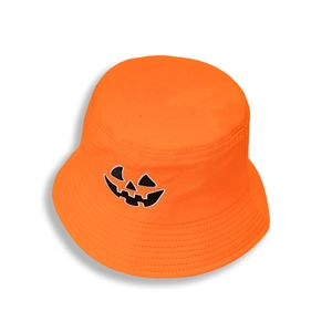 Detailed embroidery of an orange pumpkin face on a wide-brimmed festive bucket hat