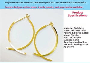 Detail showing 18K gold plated stainless steel hoops with cross design texture