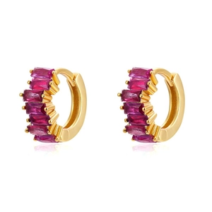 Detail of gold huggie earrings featuring baguette-cut pink cubic zirconia inlay