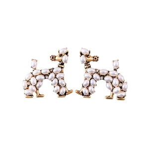 Vintage gold poodle earrings with pearls and rhinestones on a clean white background