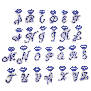 Silver A-Z initial necklaces with blue rhinestone lips and pavé crystal pendants