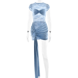 Detail of light blue lace patchwork dress featuring side ruching and long hanging ribbon