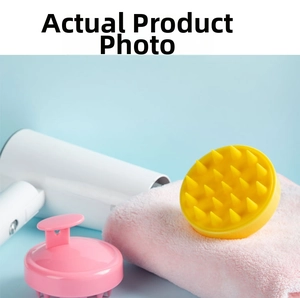 Detail of pink and yellow silicone scalp massagers with ergonomic handles and soft bristles