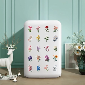 Macro view of 20 floral PET stickers applied on a white storage box in a cozy room