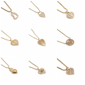 Collection of golden heart pendant necklaces with colorful zircons and stones