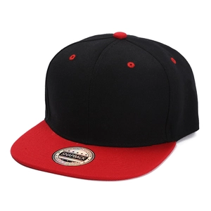 Detail of a black and red snapback cap featuring a flat brim and silver quality sticker