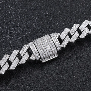 Macro shot of 12mm silver iced-out Cuban link chain with micro-paved cubic zirconia stones