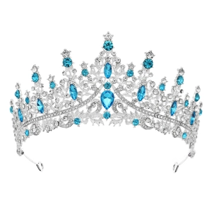 Detail of silver crown featuring blue teardrop crystals and clear rhinestone pavé