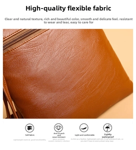 Macro view of brown lychee-textured leather mobile bag with water-resistant material