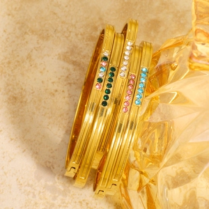 Luxury gold stainless steel bracelet set with colorful crystals in a stacked arrangement