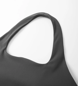Close-up of flatlock seams and premium high-stretch knit fabric on sports yoga top