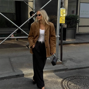 Women's brown faux suede blazer jacket in urban street style with white top and trousers