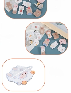 Close-up of cute acrylic animal badges showing the smooth edges and protective film layer