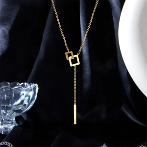 Elegant gold geometric square pendant necklace with long bar tassel chain design