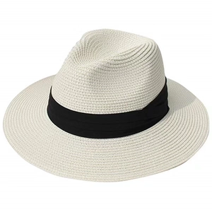 Detail of fine weave texture on cream Panama straw hat with black satin ribbon band