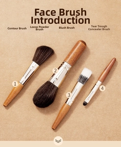 Detailed close-up of 4 professional wooden makeup brushes for powder and concealer