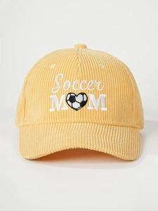 Close-up of Soccer MOM embroidery and heart soccer detail on yellow corduroy baseball cap