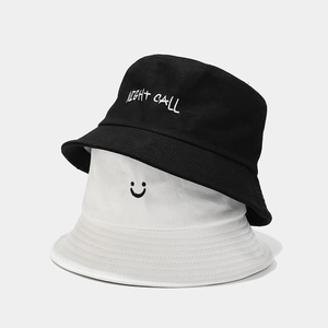 Foldable cotton bucket hats in black and white with smile and Night Call embroidery