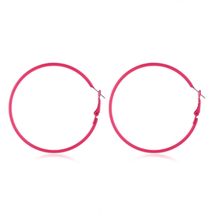 Close-up of vibrant pink 80s retro neon hoop earrings with secure butterfly backs