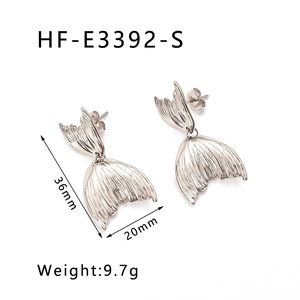 Detail view of silver mermaid tail earrings with size 36mm by 20mm and weight 9.7g