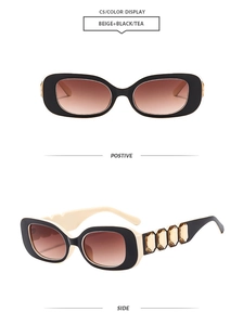 Detail view of square beige and black sunglasses with amber gemstones and gradient lenses