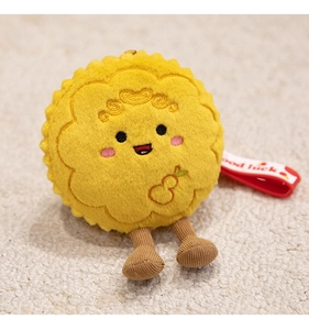 Close-up of cute rabbit mooncake plush pendant with embroidery and Good Luck ribbon