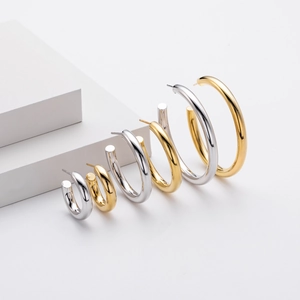 Detail view of S925 sterling silver C-shaped hoop earrings in three sizes and gold silver finishes