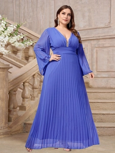 Detail view of navy blue V-neck pleated maxi dress on classical stone stairs
