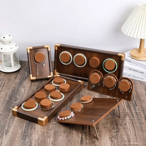 Walnut wood jewelry display trays with brown velvet inserts for luxury retail showcase
