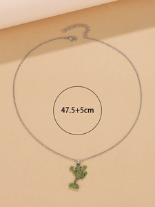 Detail showing length of 47.5+5cm on a silver chain necklace with a green frog pendant