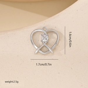 Macro shot showing dimensions and weight of a silver heart pendant with zircon stone