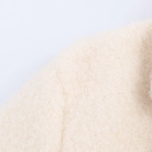 Macro detail of cream-white wool blend boucle fabric texture for a fashion women coat