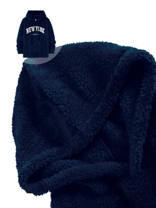 Detailed macro view of New York print on navy sherpa fleece hoodie fabric texture