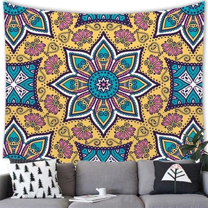 Vibrant yellow Mandala wall tapestry in a cozy living room setting behind a sofa