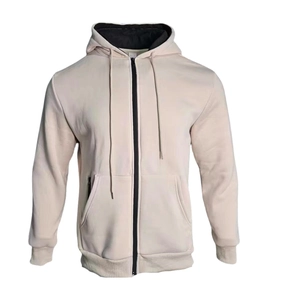 Detail of light beige hoodie with black contrast zipper, drawstring hood and kangaroo pockets